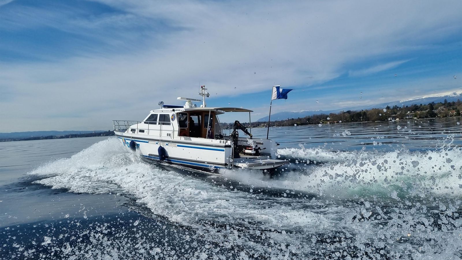 Search and rescue boat moving at speed across open water